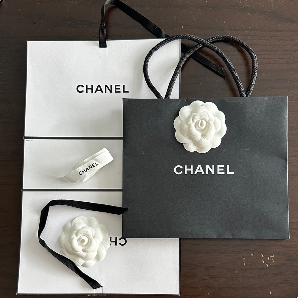 Chanel gift bag with ribbon and wrapping paper